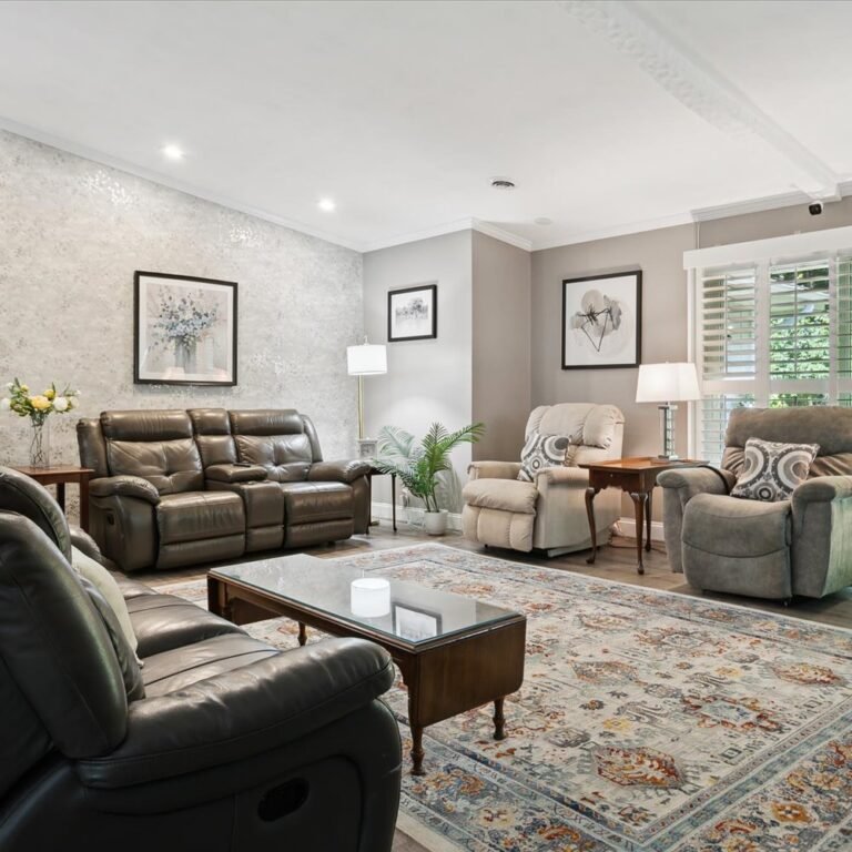 Spacious bright living area with comfortable seating at Kendra’s Place assisted living and memory care in Canton Michigan