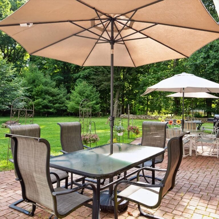 Inviting outdoor dining patio at Kendra’s Place assisted living Canton Michigan. Comfortable shaded seating surrounded by lush gardens for residents and families to enjoy together.